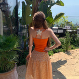 Yunnan Sanya Seaside Holiday Set Dopamine Orange Hanging Sling High Waist Crumb Skirt Two Sets